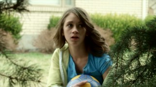 A high fall from her attempt to retrieve this soccer ball from this tall tree gives Riley Taylor (Kirstin Dorn) healing powers.
