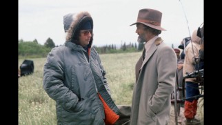 A warmly-dressed Michael Cimino directs Kris Kristofferson in one of the production photos that illustrates Cimino's newly-recorded audio reflections.