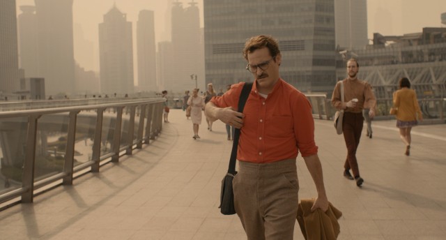 With his mustache, bright shirt, and high-waisted pants, Theodore Twombly (Joaquin Phoenix) is a stylish man of the future in "Her."