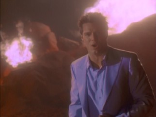 Ricky Martin performs Spanish language theme song "No Importa La Distancia" from the fiery depths of Hades.