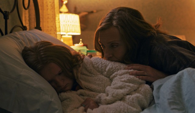 Annie Graham (Toni Collette) consoles her troubled 13-year-old daughter Charlie (Milly Shapiro) in "Hereditary."