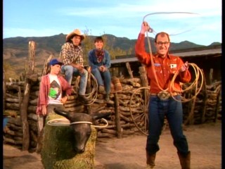 The gang gives Mr. Ernst (David Brisbin) a lassoing lesson.