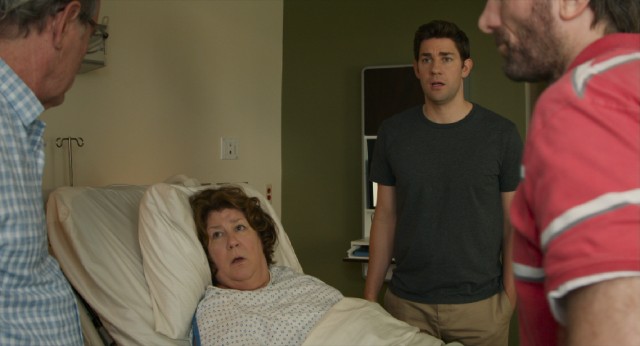 In "The Hollars", a mother's (Margo Martindale) brain tumor reunites her family (John Krasinski, Richard Jenkins, and Sharlto Copley) at the hospital.