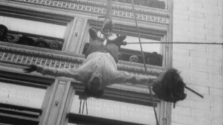 The real Harry Houdini defies death, dangling high above San Francisco upside-down in this old clip.