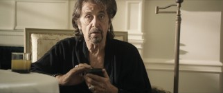 Simon Axler (Al Pacino) struggles to describe his relationship, while playing with his smart phone.