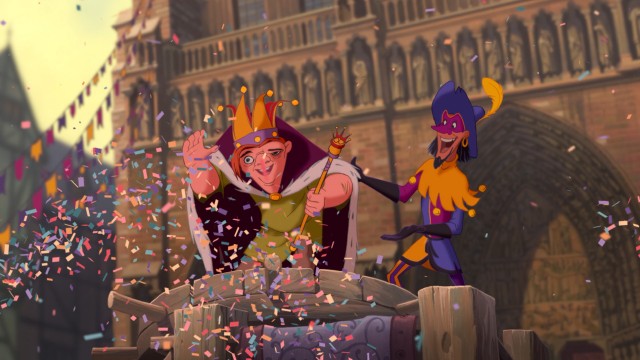 Alongside Clopin, Topsy Turvy Day's King of Fools waves to his adoring public.