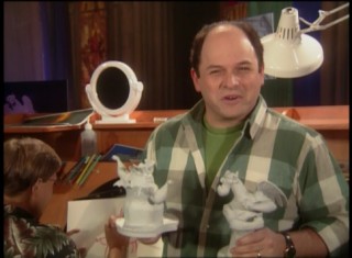 Jason Alexander clutches gargoyle sculptures as host of Disney Channel's "The Making of 'The Hunchback of Notre Dame.'"