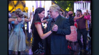 Katniss' dance with Plutarch (Philip Seymour Hoffman) is one of many Murray Close still photographs from the series displayed in "Picturing Panem."
