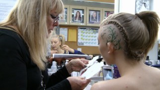 Natalie Dormer gets an extreme haircut to play Cressida in "Utilitarian Chic."