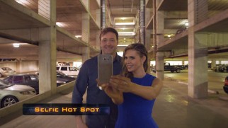 Oh, deep cable: one of the hosts of the Pop TV show "Jet to the Set" snags a selfie at an Atlanta parking lot where a "Catching Fire" scene was shot.