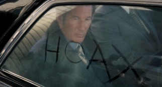Clifford Irving (Richard Gere) writes a titular word on a car window that's disconcertingly dirty on the inside.
