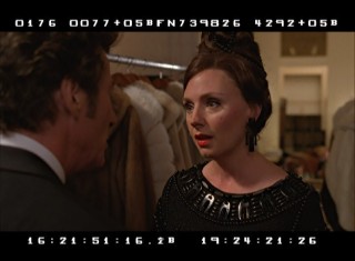 The new "Outtakes and Unused Clips" reel includes alternate edits of scenes like this one, in which Irving consults publisher Andrea Tate (Hope Davis) at a masquerade ball.