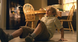 Lucas (Nathan Gamble) is knocked back on his butt by fear.