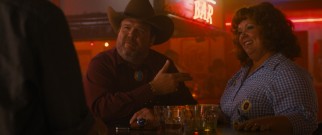 Big Chuck (Eric Stonestreet) likes what he sees in Diana (Melissa McCarthy).