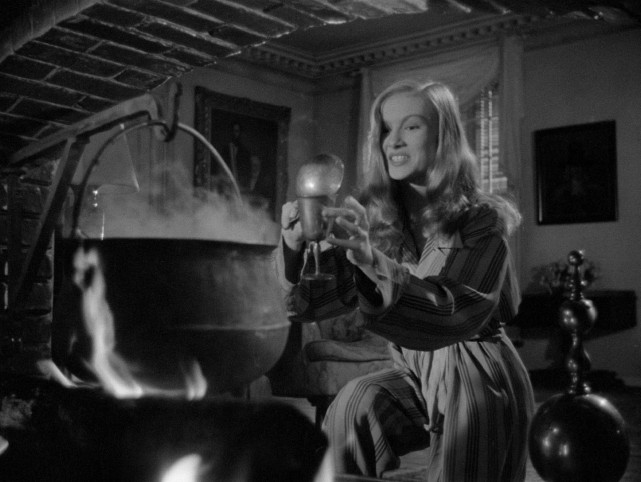 Jennifer (Veronica Lake) bottles a freshly-brewed love portion she intends to use on her target in the 1942 comedy "I Married a Witch."