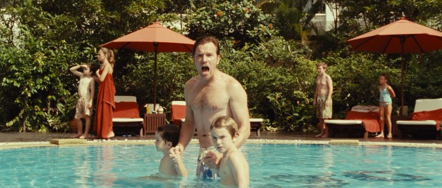 Henry (Ewan McGregor) and the two youngest sons (Oaklee Pendergast and Samuel Joslin) brace themselves for the wall of water heading their way.