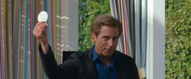 A more ordinary-looking Burt Wonderstone (Steve Carell) pulls coins from behind children's ears at a 10th birthday party.