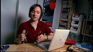 In "Vowelett", NPR personality Sarah Vowell plays with the visible and invisible action figures of Violet Parr, the teenaged character she voices.