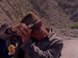 Harrison Ford hopes that staples will keep his iconic hat from blowing away in "The Making of 'The Last Crusade.'"