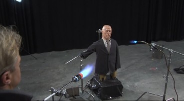 A dummy has his face melted off in a demonstration of Raiders' climactic effect.