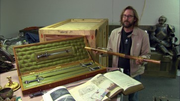 Unfazed by the dead knight behind him, Doug Harlocker talks "Iconic Props."