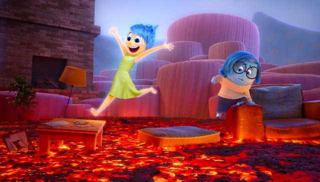 Joy and Sadness navigate through fiery Imagination Land in Pixar's "Inside Out."