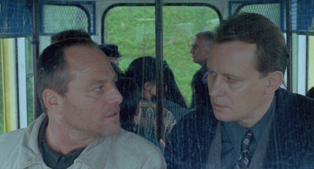 On a Norwegian cable car, detective Jonas Engstrom (Stellan Skarsgrd) confronts author and suspected killer Jon Holt (Bjrn Floberg).