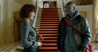 Though out of his element, Driss (Omar Sy) comes to make himself at home in Philippe's stately mansion.