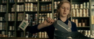 As a young woman, Margaret (Alexandra Roach) works in her father's grocery store.