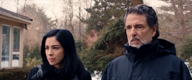 While upstate for Bruce's insurance convention, Laney (Sarah Silverman) pays a visit to her long estranged father (Chris Sarandon).