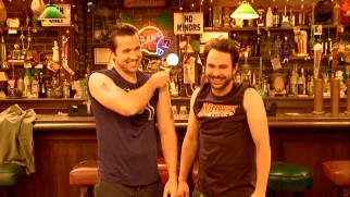 Rob McElhenney and Charlie Day can't help but crack up while flexing in their Fight Milk promo.