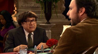 A toupeed Frank (Danny DeVito) and Charlie (Charlie Day) refuse to pay tribute to Mac and Dennis seated elsewhere in "The Gang Dines Out."