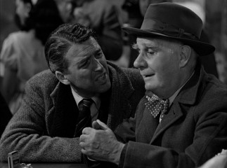 Second-class guardian angel Clarence (Henry Travers) has difficulty blending in with George at Nick's bar.