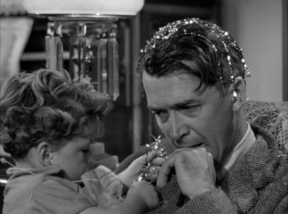 Tinsel in his hair or not, George Bailey (James Stewart) has seen better Christmas Eves.