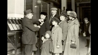 Lewis Hine Ellis Island photographs that inspired the look of "The Immigrant" are shown.