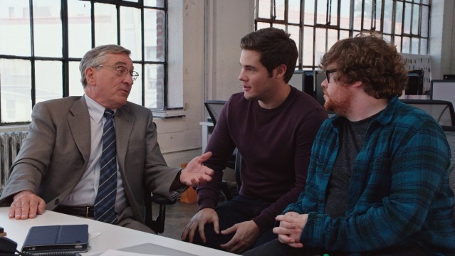 The old guy (Robert De Niro) shares some of his wisdom and experience with his much younger co-workers (Adam DeVine and Zack Pearlman).