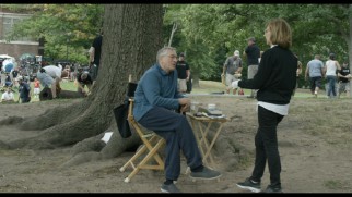 Nancy Meyers directs Robert De Niro in the park set of "The Intern."