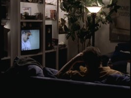 Eddie rewatches his glory days when he was a mustachioed young pitcher