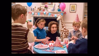 Jackie's social secretary Nancy Tuckerman (Greta Gerwig) oversees her son's birthday party in this photo gallery still.
