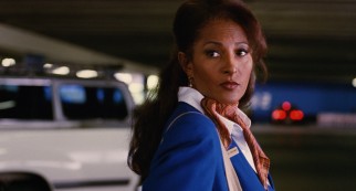 Cabo Air stewardess Jackie Brown (Pam Grier) is stopped by law officers in an LAX parking lot.