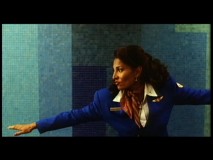 Pam Grier surfs along the conveyor belt to the sound of Dick Dale's "Misirlou" in this "alternate opening" that closes the deleted scenes section.