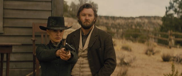 Hired to be a gunslinger, Dan Frost (Joel Edgerton) sees his ex Jane Ballard (Natalie Portman) fire a gun in "Jane Got a Gun."