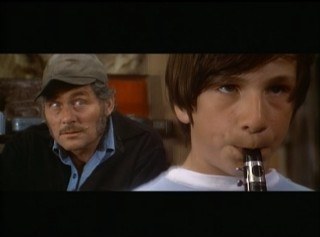 Quint (Robert Shaw) adds to a young flute-playing shopper's performance of "Ode to Joy" in this standout deleted scene.