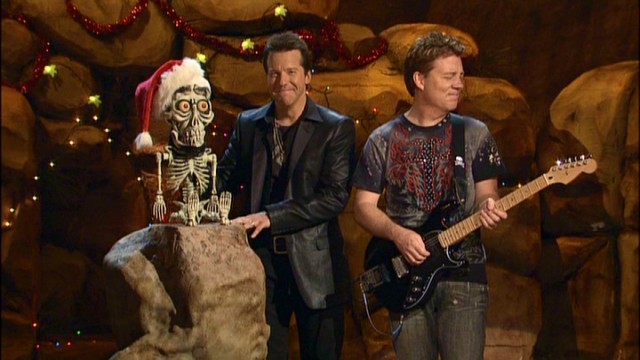Achmed the Dead Terrorist and Jeff Dunham have "guitar guy" Brian Haner fighting laughter during "Jeff Dunham's Very Special Christmas Special."