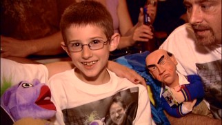 This family wears its appreciation of Jeff Dunham on its shirts and hands.