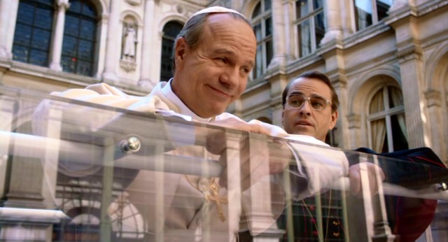 Pope John Paul II (Aurlien Recoing) proudly shows off his new bulletproof Popemobile to his friend and advisor, Lustiger (Laurent Lucas).