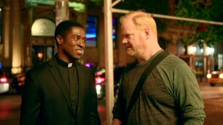 Jim has reservations about taking Father Nicholas (Tongayi Chirisa) to the stand-up comedy club.