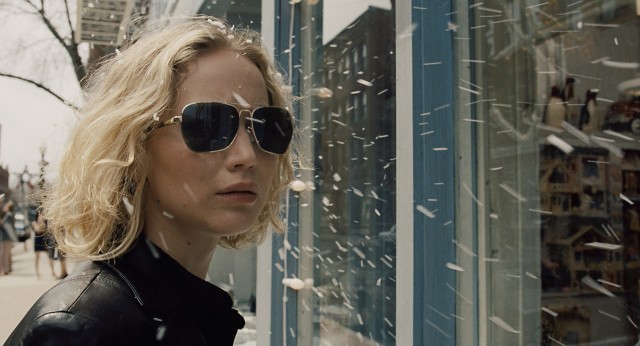 Jennifer Lawrence stars as the title character in "Joy", seen here standing beneath a fake snow machine in Dallas.