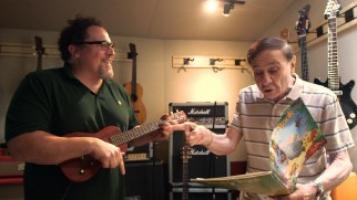 Richard Sherman sings while Jon Favreau plays ukulele in "The Return of a Legend."