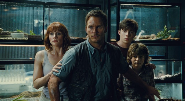 Claire (Bryce Dallas Howard), Owen (Chris Pratt), Zach (Nick Robinson), and Gray (Ty Simpkins) brace themselves in the midst of some dinosaur danger in "Jurassic World."